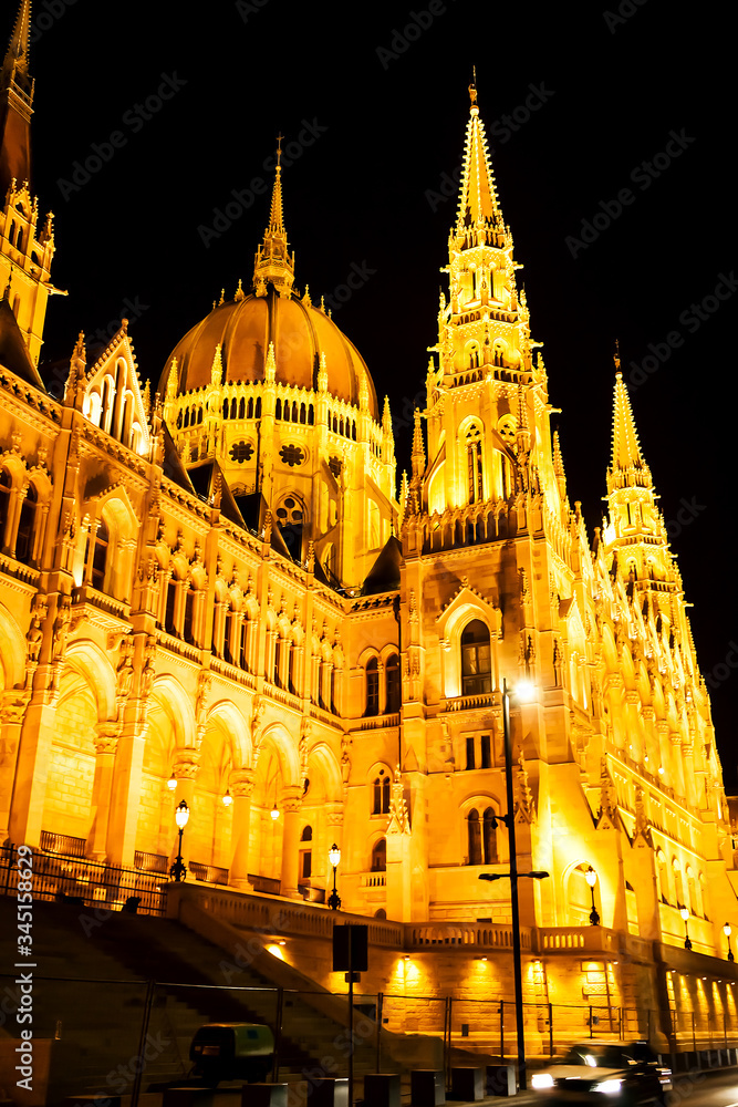 Night view of the illuminated building of the hungarian parliament in budapest.