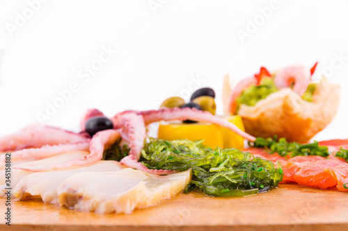 Fish platter on a wooden board on a white background