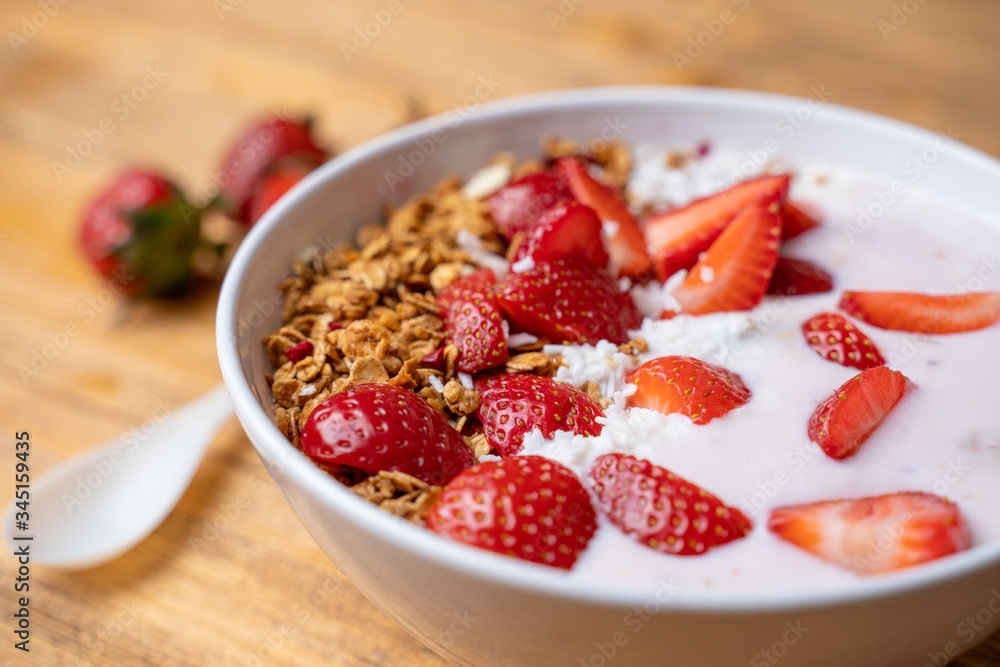 Breakfast with yogurt, granola, with superfood toppings, closeup view. Concept of healthy eating, healthy lifestyle Breakfast with yogurt, granola, with superfood toppings, closeup view. Concept of healthy eating, healthy lifestyle