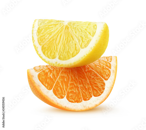 Isolated citrus slices. Pieces of lemon and orange fruit on top of each other isolated on white background photo