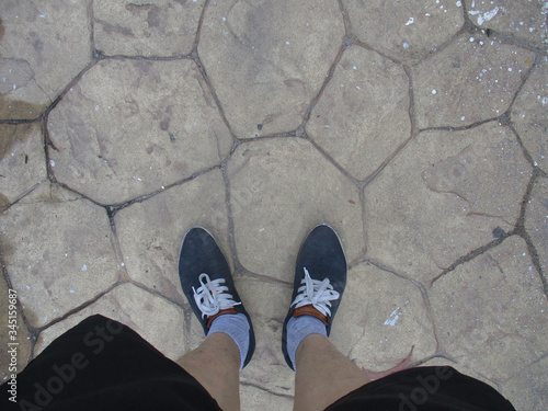 Look on two feet, The shadow of the old cement wall surface with cracks, texture, backgrounds for design      thailand