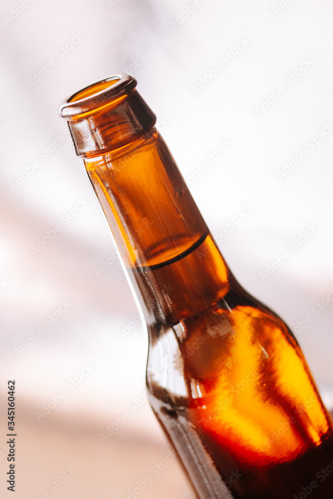 Bottle of beer on a natural background