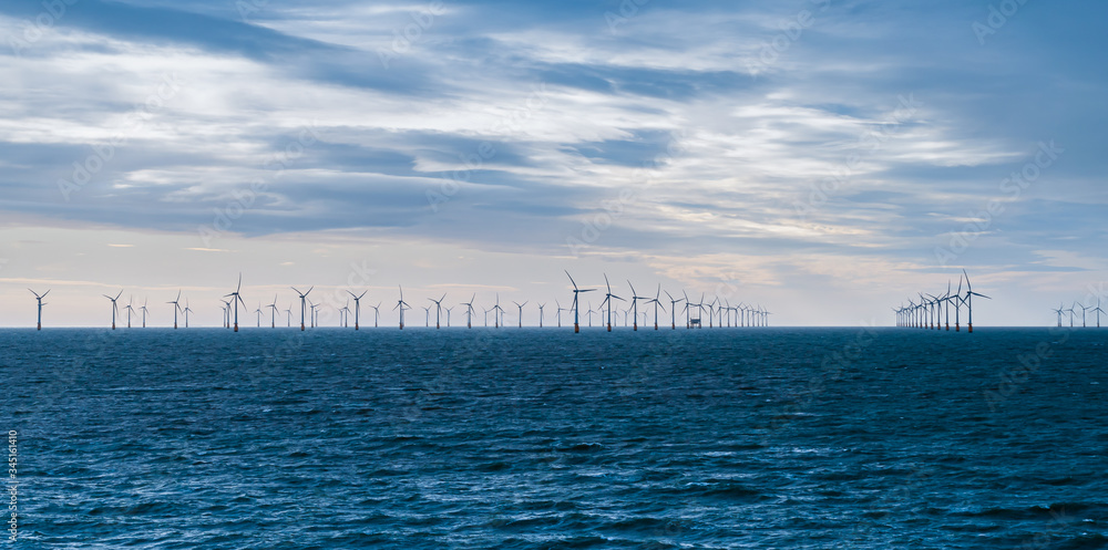 Wind turbines at sea. Offshore wind power farm in the North Sea. 