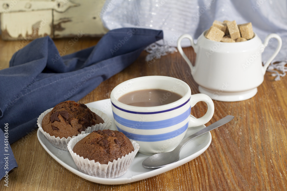 Chocolate cup, muffins and sugar Chocolate cup, muffins and sugar