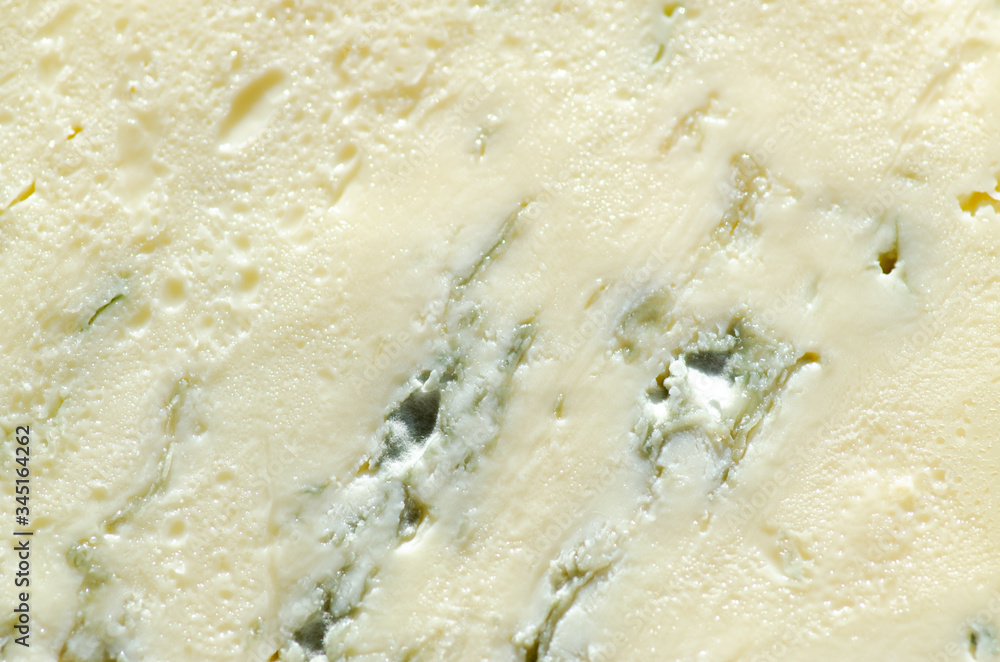 Background of blue cheese with Gorgonzola mold, traditional soft blue Italian cheese Background of blue cheese with Gorgonzola mold, traditional soft blue Italian cheese