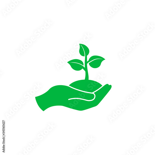 Hand holding seedlings with leaves or palm with sprout, ecology icon in green on an isolated white background. EPS 10 vector. © Coosh448