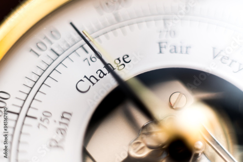 needle of a barometer pointing at the word change. close up of the word