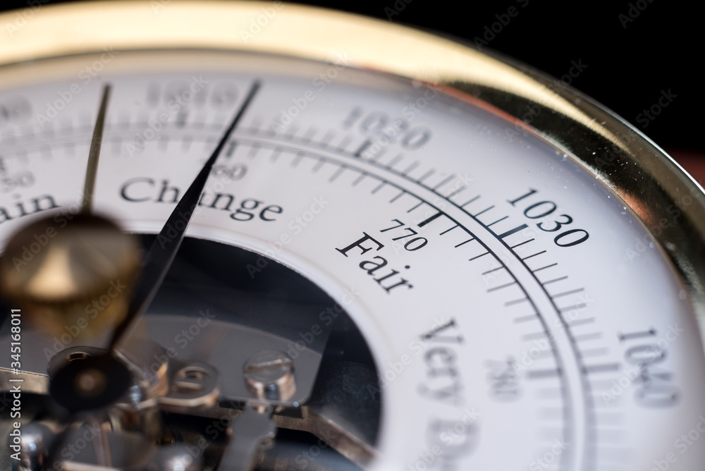 needle of a barometer pointing at the word change. close up with the word Fair in focus needle of a barometer pointing at the word change. close up with the word Fair in focus