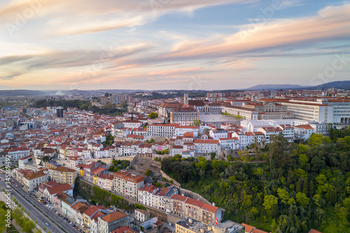 Coimbra drone aerial of beautiful buildings university at sunset, in Portugal © Luis