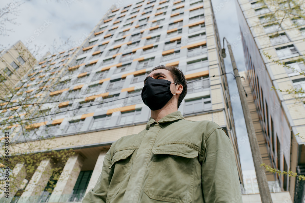 portrait of a man in a black medical mask. Coronavirus. portrait of a man in a black medical mask. Coronavirus.