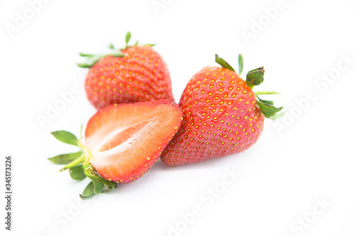 Ripe fresh organic strawberries isolated on white background.
