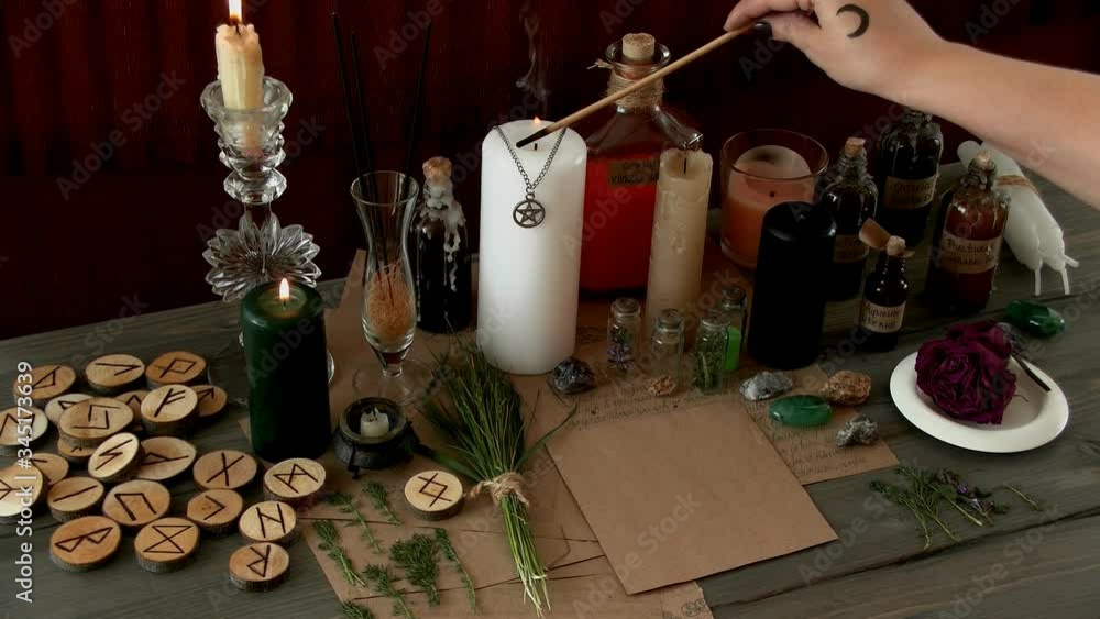 a woman performs a ritual, a witchcraft rite a woman performs a ritual, a witchcraft rite