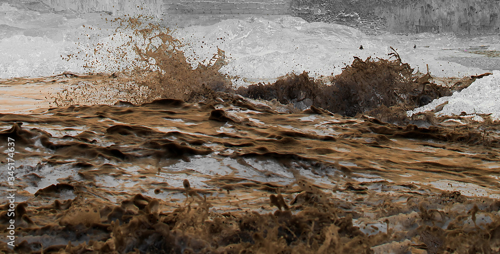 Real river of mud, splashing dirty water, mud texture or background Real river of mud, splashing dirty water, mud texture or background
