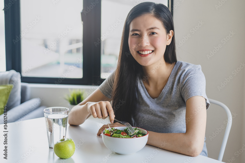 eat healthy food on wellness lifestyle. Beauty young woman eating salad as a breakfast. eat healthy food on wellness lifestyle. Beauty young woman eating salad as a breakfast.