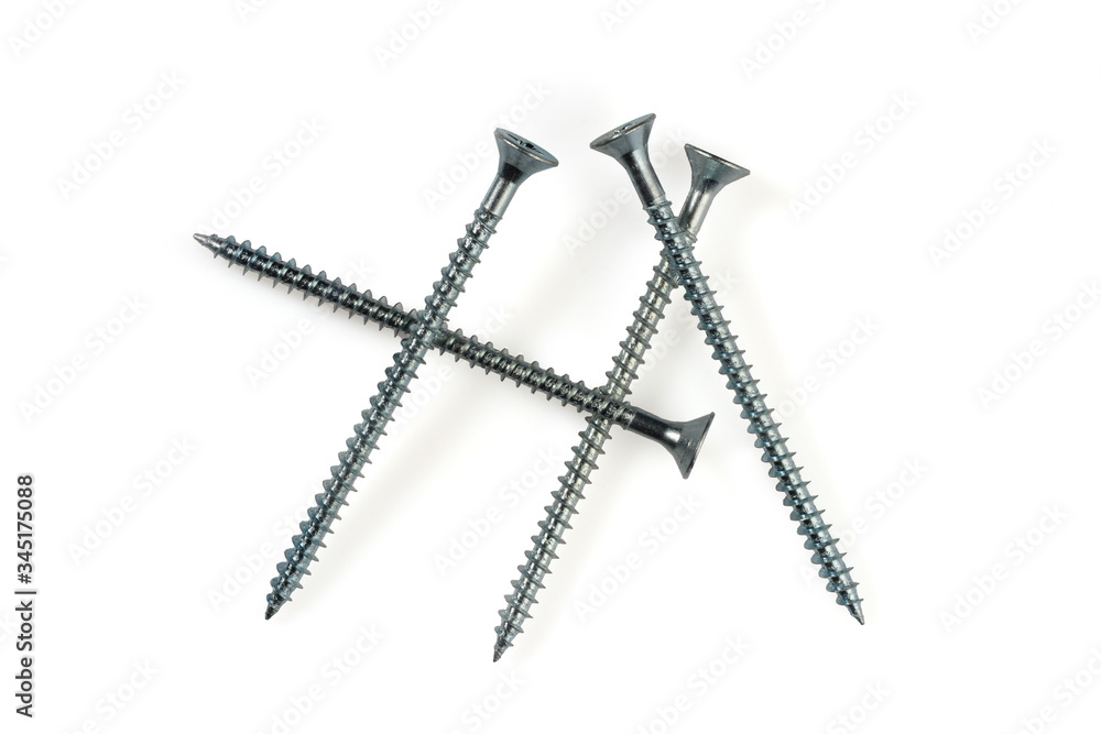 Four long self tapping iron screws with flat head, macro close-up isolated on white background. Four long self tapping iron screws with flat head, macro close-up isolated on white background.