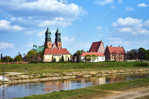 river Warta and the towers of historic cathedral in Poznan.