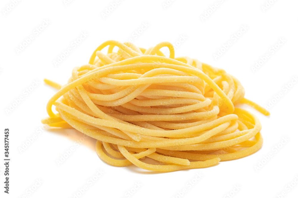 Fresh uncooked spaghetti pasta isolated on a white background Fresh uncooked spaghetti pasta isolated on a white background