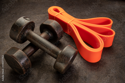 old rusty dumbbells and resistance bands photo