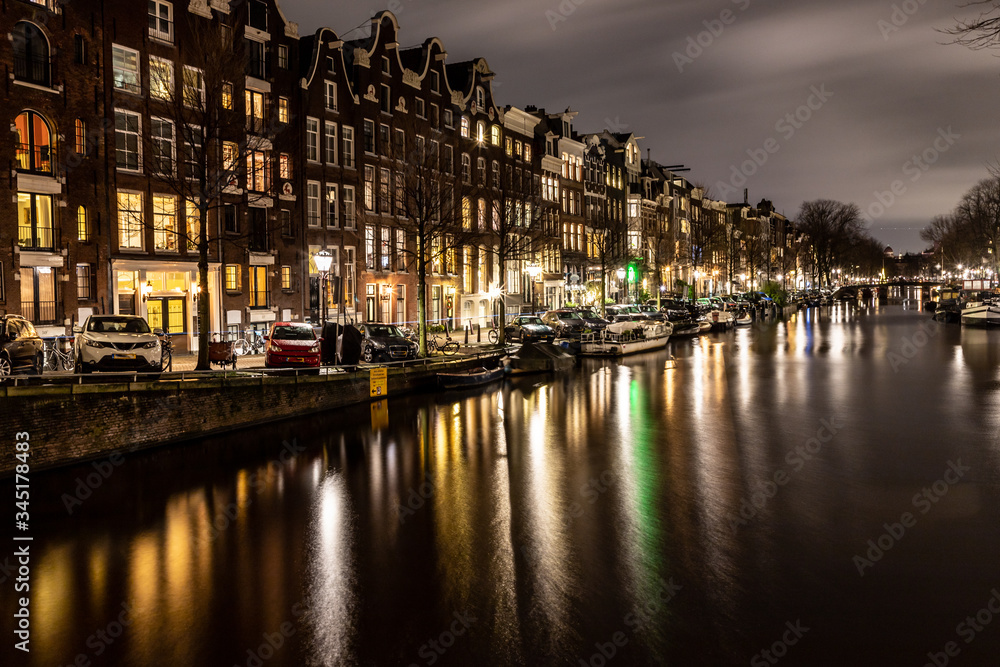 Night lights of building and biclycles in Amsterdan