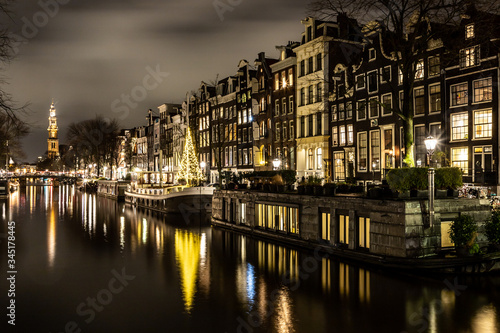 Night lights of channel and biclycles in Amsterdan