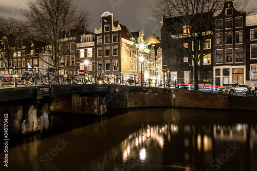 Night lights of building and biclycles in Amsterdan © lisandrotrarbach