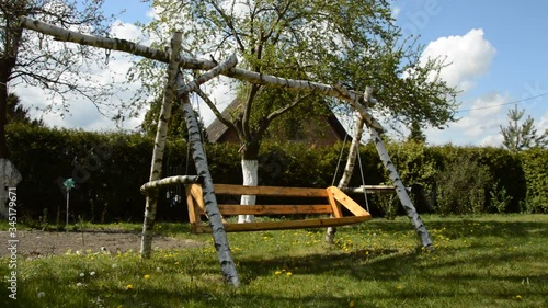 Wallpaper Mural empty swing in the garden Torontodigital.ca