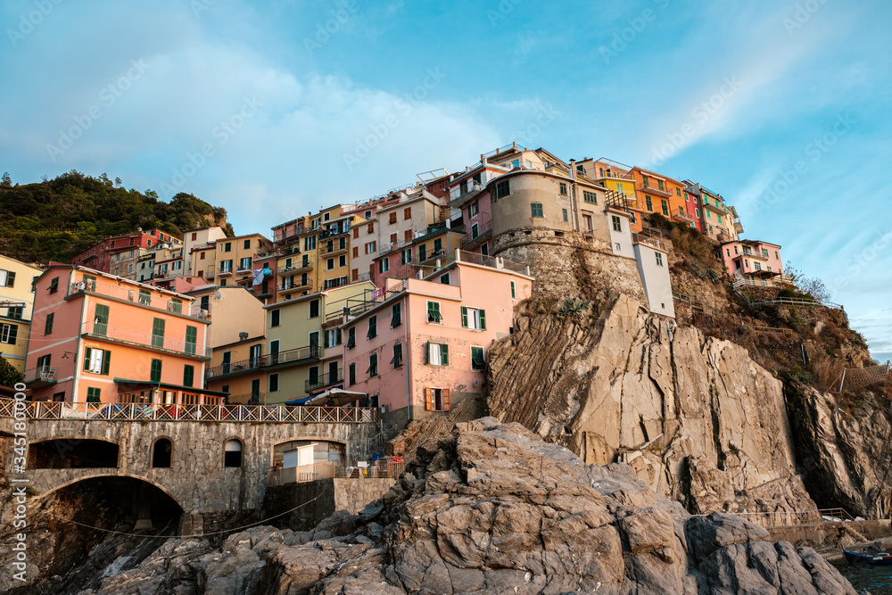 Nice view of Manarola in golden hour. Ancient village of Cinque Terre National Park in Liguria, Italy