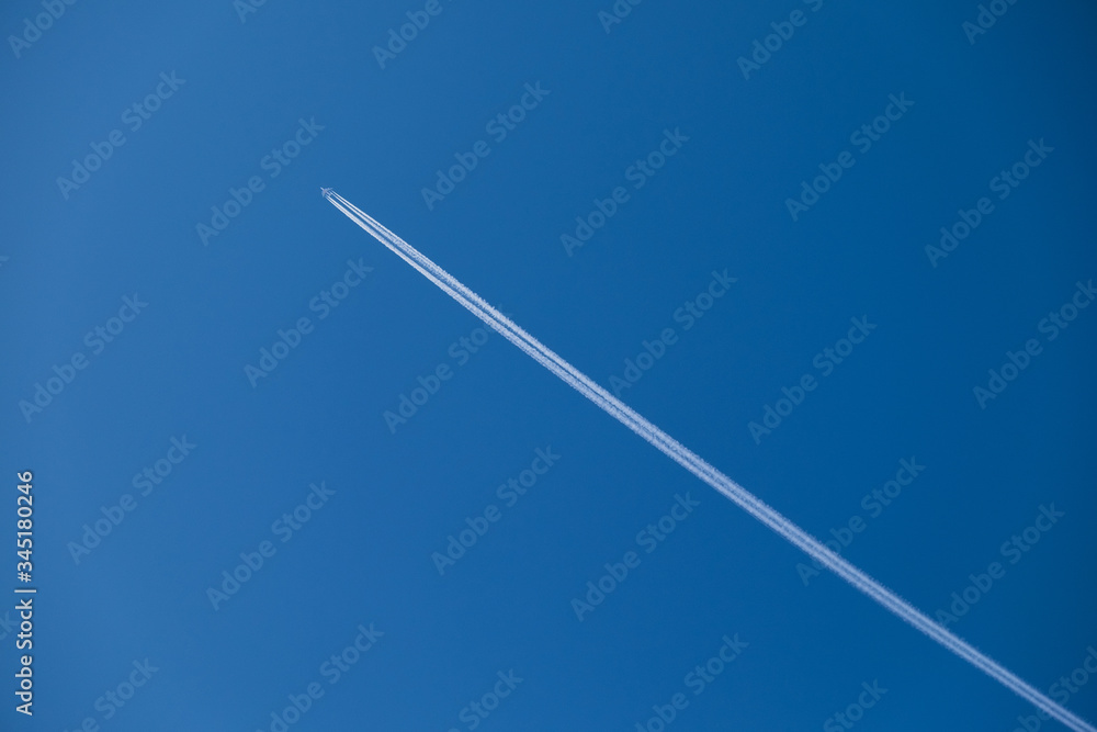 the plane is high in the sky and the trace of the plane the plane is high in the sky and the trace of the plane