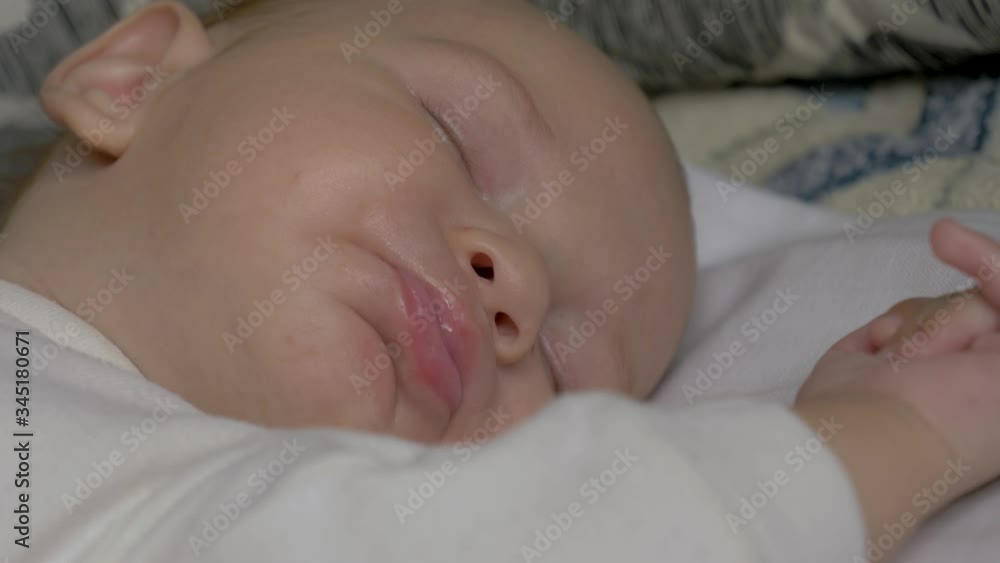 Close Up Of A Sleeping Baby Smacking His Lips Close Up Of A Sleeping Baby Smacking His Lips