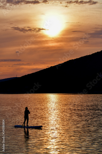 Sup boarding on sunset