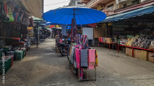 Empty outdoor shopping market in Tachileik, Myanmar © Heather
