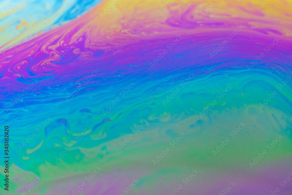 abstract background iridescent paint, in warm colors iridescent interference rainbow