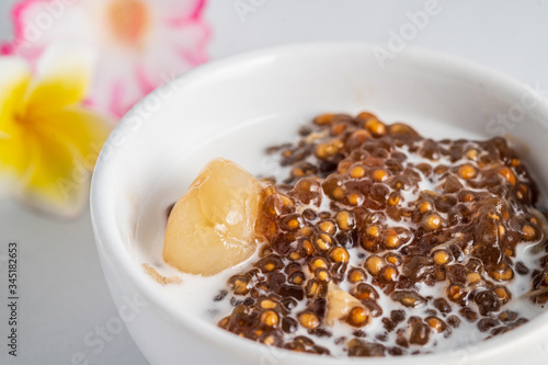 Thai desserts, sago desserts with longan topped with coconut milk