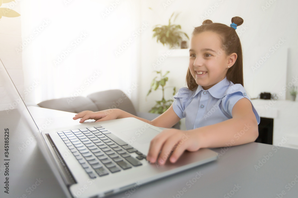 cheerfully cute girl children excited using computer learning schoolwork. kid enjoy e-learning in holiday at home. cheerfully cute girl children excited using computer learning schoolwork. kid enjoy e-learning in holiday at home.