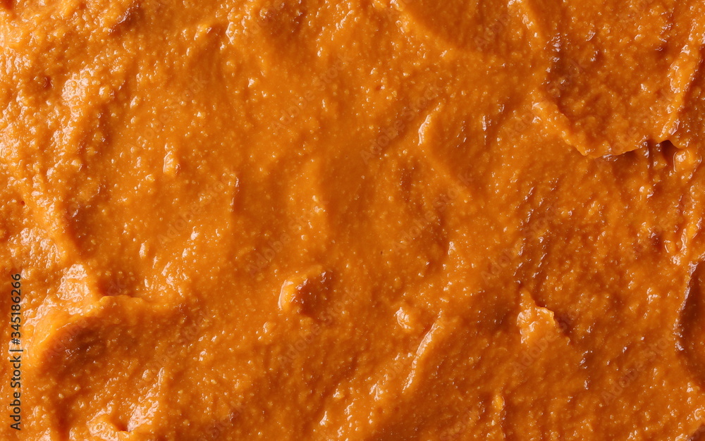 Tomato flavored hummus surface, background and texture Tomato flavored hummus surface, background and texture