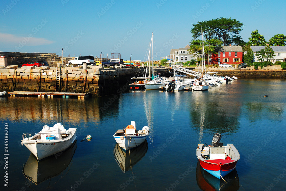 Boats rest in a calm harbor at Rockport, Massachusetts