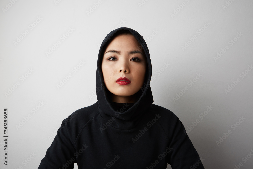 Close-up portrait of a young adult Malaysian woman wearing traditional head scarf hijab. Space for text. Close-up portrait of a young adult Malaysian woman wearing traditional head scarf hijab. Space for text.