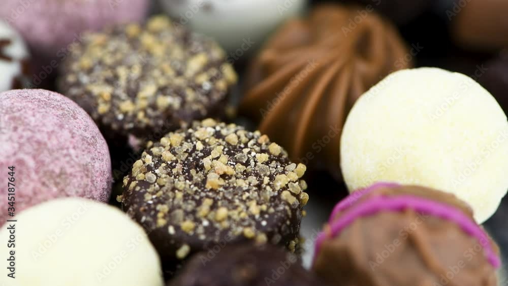 Pralines on a rotating plate (close-up; seamless loopable) Pralines on a rotating plate (close-up; seamless loopable)