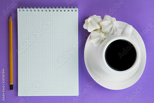 Notepad with the inscription recipes on a lilac background. Flat lay.