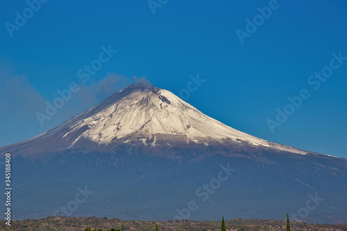 snowy popocatepetl volcano with blue sky