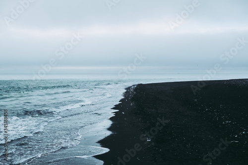 Calm black sand beach in Iceland