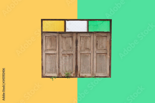 wooden window with green and yellow wall