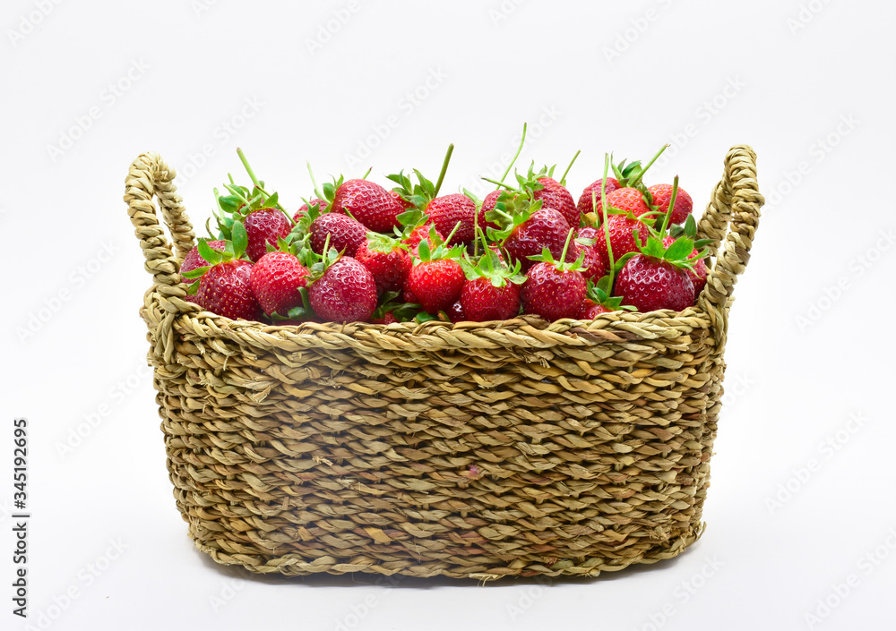 Basket full of strawberries isolated on white background Basket full of strawberries isolated on white background