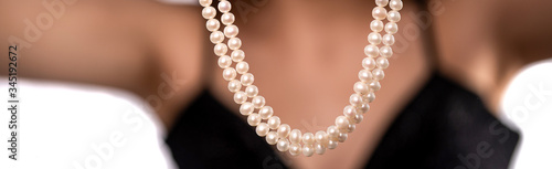 woman wearing pearl diamond necklace