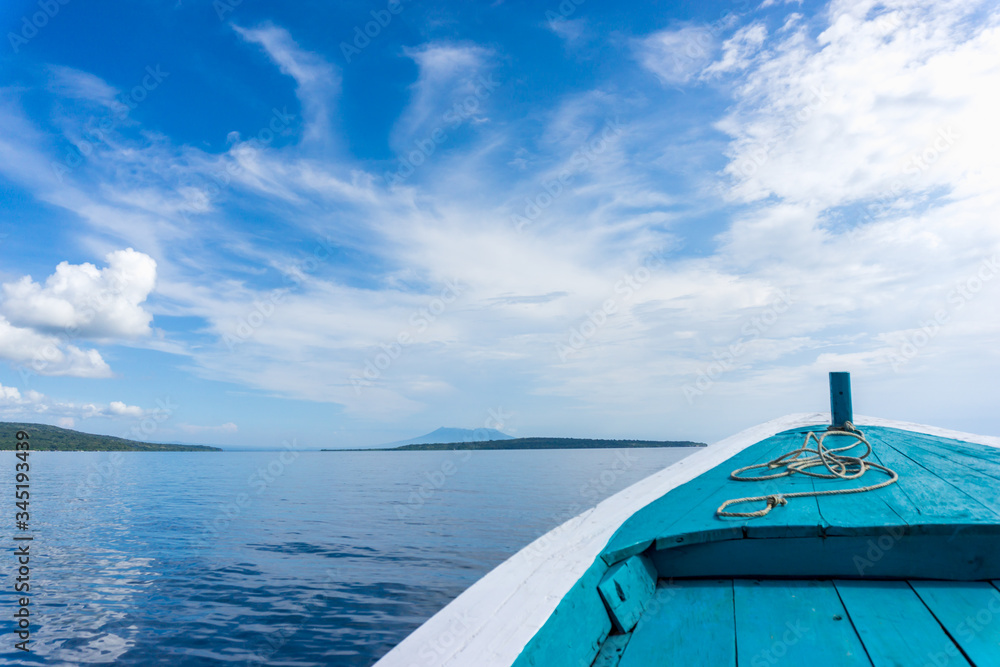 Beautiful view from a bow of a white and blue boat at seaward. Copy space 