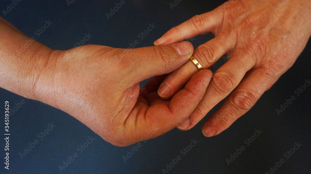 Hands putting on rings love elderly people Hands putting on rings love elderly people