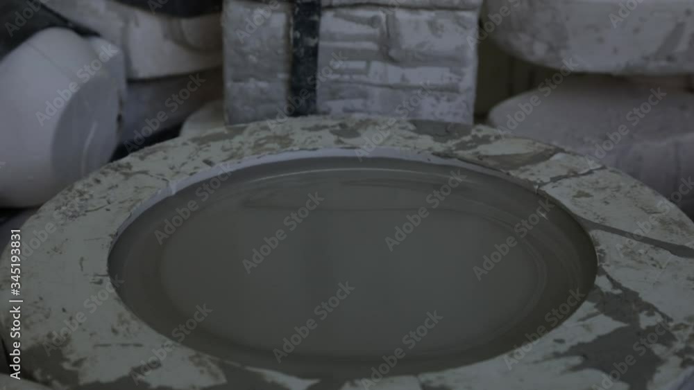 Clay workshop. Wooden shelf. Two forms for pouring clay for making dishes. Close up. Panorama. Grayscale. Clay workshop. Wooden shelf. Two forms for pouring clay for making dishes. Close up. Panorama. Grayscale.