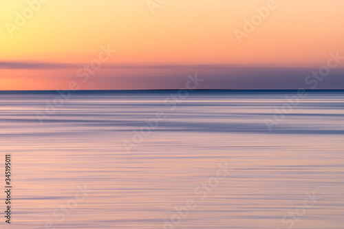 colorful sunset over the sea with orange sky. Abstract