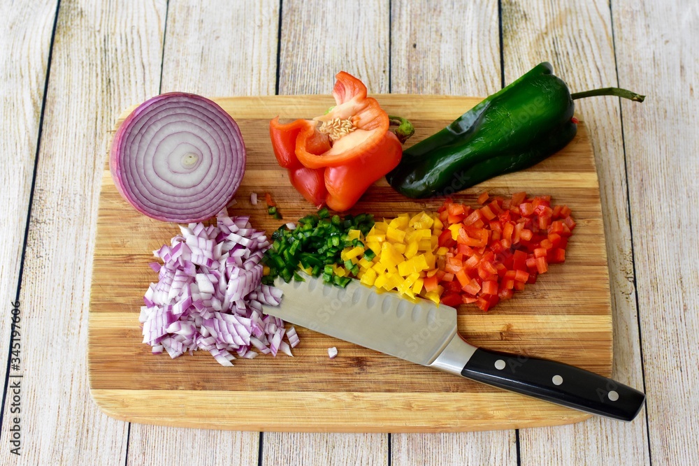 Fresh organic vegetables chopped and diced for healthy family meals and salads Fresh organic vegetables chopped and diced for healthy family meals and salads
