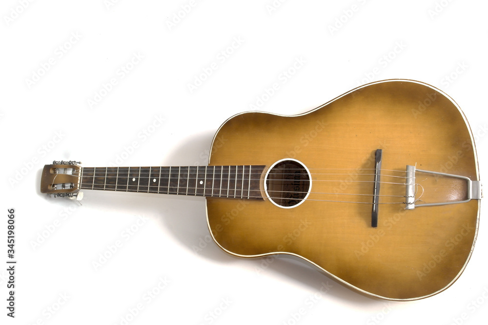 guitar without a single string on a white background